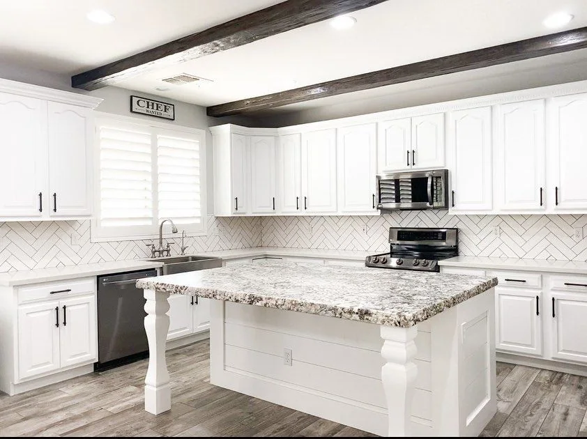 Bright kitchen with wood ceiling beam and island, Surprise AZ