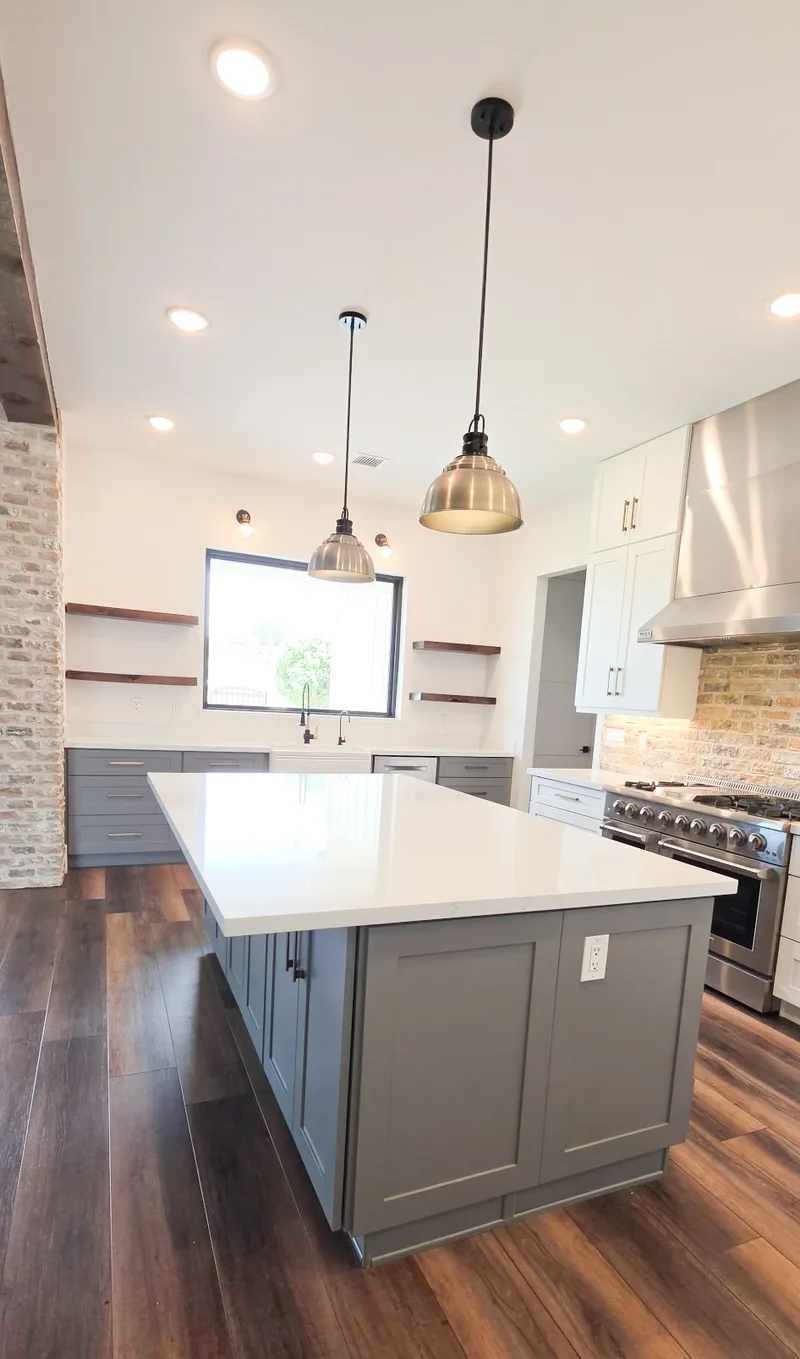 Modern farmhouse kitchen with gray shaker island and pendant lights, Valley AZ
